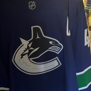 NHL Vancouver Canucks Navy Blue Hockey Jersey with Team Crest